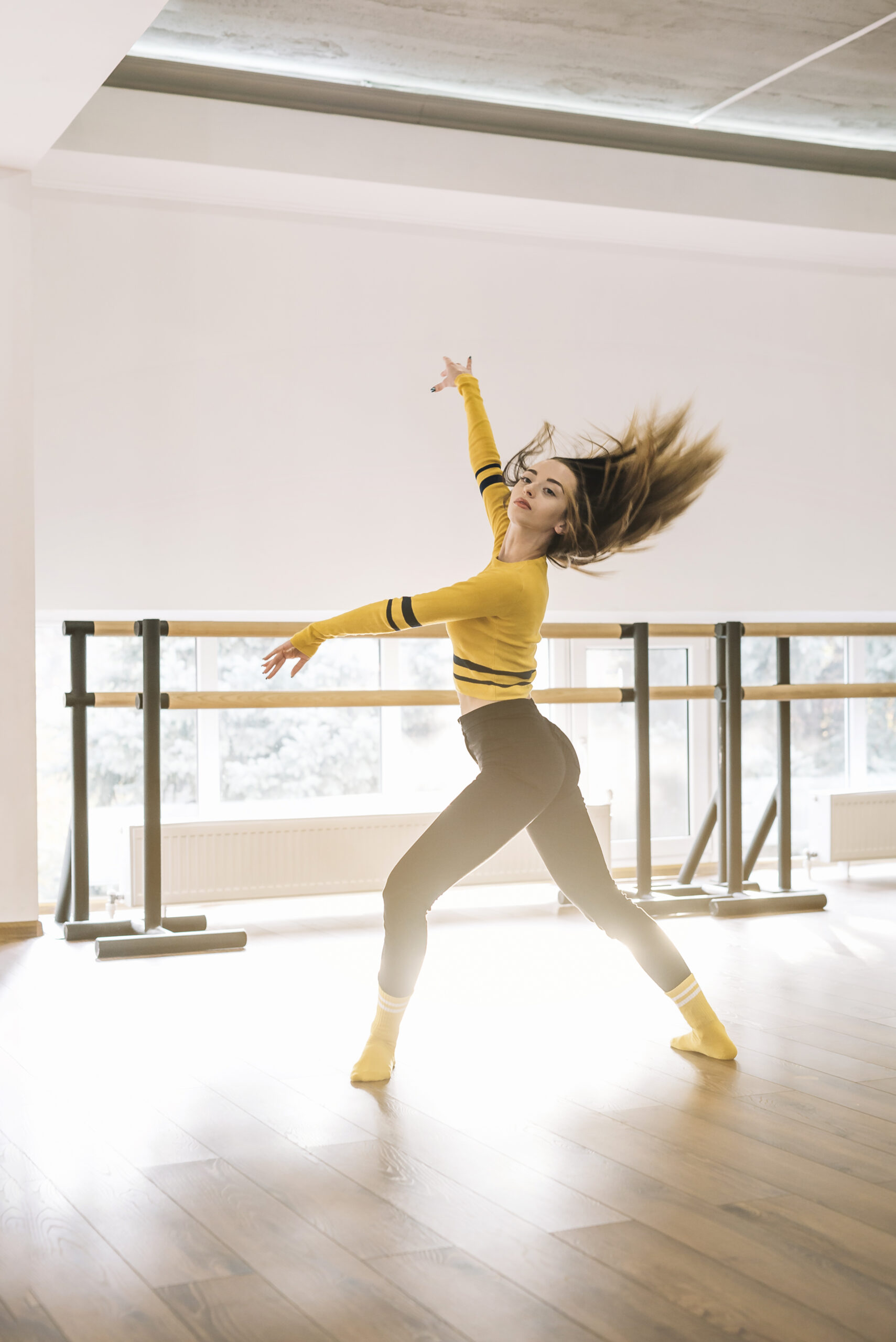young female dancer practising dance studio scaled